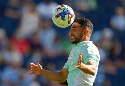 Oct 2, 2022; Kansas City, Kansas, USA; Seattle Sounders midfielder Cristian Roldan (7) warms up prior to a match against the Sporting Kansas City at Children's Mercy Park. Mandatory Credit: Jay Biggerstaff-USA TODAY Sports