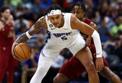 Oct 14, 2022; Orlando, Florida, USA; Orlando Magic forward Paolo Banchero (5) is defended by Cleveland Cavaliers forward Isaac Okoro (35) during the second quarter at Amway Center. Mandatory Credit: Kim Klement-USA TODAY Sports
