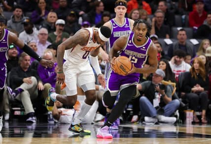 Nov 28, 2022; Sacramento, California, USA; Sacramento Kings guard Davion Mitchell (15) steals the ball during the second quarter against the Phoenix Suns at Golden 1 Center. Mandatory Credit: Sergio Estrada-USA TODAY Sports