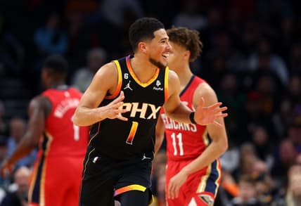 Dec 17, 2022; Phoenix, Arizona, USA; Phoenix Suns guard Devin Booker (1) reacts against the New Orleans Pelicans at Footprint Center. Mandatory Credit: Mark J. Rebilas-USA TODAY Sports
