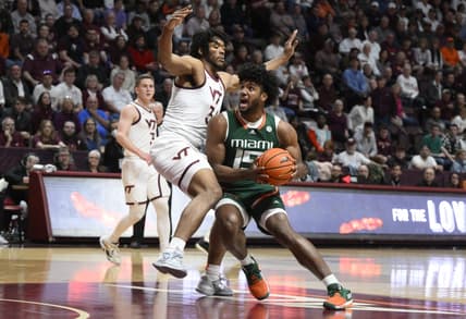 Feb 21, 2023; Blacksburg, Virginia, USA; Miami (Fl) Hurricanes forward Norchad Omier (15) drives against Virginia Tech Hokies forward Mylyjael Poteat (34) in the first half at Cassell Coliseum. Mandatory Credit: Lee Luther Jr.-USA TODAY Sports