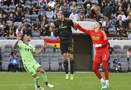 Apr 8, 2023; Los Angeles, California, USA;  Austin FC defender Amro Tarke (3) looks on as Los Angeles FC defender Giorgio Chiellini (14) deflects a shot on goal in front of Los Angeles FC goalkeeper Eldin Jakupovic (1) in the first half at BMO Stadium. Mandatory Credit: Jayne Kamin-Oncea-USA TODAY Sports