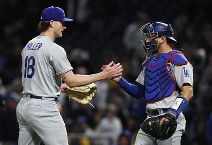 Apr 25, 2023; Pittsburgh, Pennsylvania, USA;  Los Angeles Dodgers relief pitcher Shelby Miller (18) and catcher Austin Barnes (15) shake hands after defeating the Pittsburgh Pirates at PNC Park. Los Angeles won 8-7. Mandatory Credit: Charles LeClaire-USA TODAY Sports