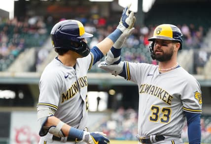 May 4, 2023; Denver, Colorado, USA; Milwaukee Brewers first baseman Rowdy Tellez (11) celebrates his solo home run with designated hitter Jesse Winker (33) run against the Colorado Rockies in the first inning at Coors Field. Mandatory Credit: Ron Chenoy-USA TODAY Sports