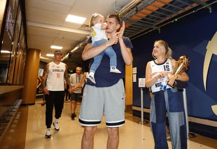 Jun 12, 2023; Denver, Colorado, USA; Denver Nuggets center Nikola Jokic (15) celebrates with his family after the Nuggets won the NBA championship by defeating the Miami Heat in game five of the 2023 NBA Finals at Ball Arena. Mandatory Credit: Isaiah J. Downing-USA TODAY Sports