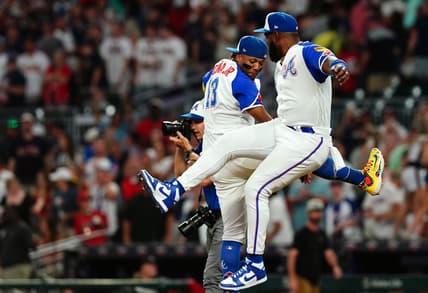 Aug 19, 2023; Cumberland, Georgia, USA; Atlanta Braves right fielder Ronald Acuna Jr. (13) and Atlanta Braves designated hitter Marcell Ozuna (20) celebrate their victory against the San Francisco Giants at Truist Park. Mandatory Credit: John David Mercer-USA TODAY Sports