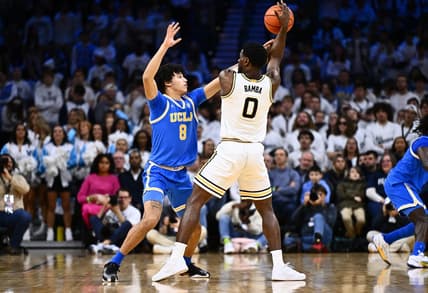 Dec 9, 2023; Philadelphia, Pennsylvania, USA; UCLA Bruins guard Ilane Fibleuil (8) defends Villanova Wildcats guard TJ Bamba (0) in the first half at Wells Fargo Center. Mandatory Credit: Kyle Ross-USA TODAY Sports
