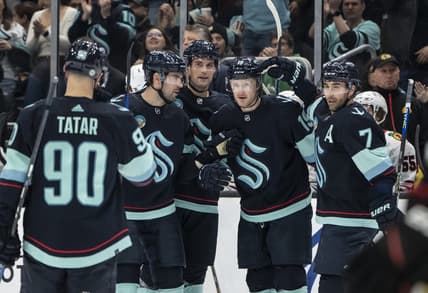 Jan 24, 2024; Seattle, Washington, USA; Seattle Kraken forward Jared McCann (19), second from right, is congratulated by forward Jordan Eberle (7), forward Tomas Tatar (90), defenseman Justin Schultz (4), second from left, and defenseman Brian Dumoulin (8) after scoring a goal against the Chicago Blackhawks during the first period at Climate Pledge Arena. Mandatory Credit: Stephen Brashear-USA TODAY Sports