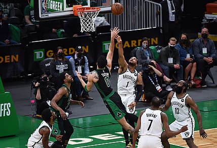 May 28, 2021; Boston, Massachusetts, USA; Boston Celtics forward Jayson Tatum (0) shoots the ball over Brooklyn Nets forward Bruce Brown (1) during the second half during game three in the first round of the 2021 NBA Playoffs at TD Garden. Mandatory Credit: Bob DeChiara-USA TODAY Sports