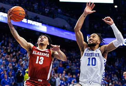 Feb 19, 2022; Lexington, Kentucky, USA; Alabama Crimson Tide guard Jahvon Quinerly (13) goes to the basket against Kentucky Wildcats guard Davion Mintz (10) during the first half at Rupp Arena at Central Bank Center. Mandatory Credit: Jordan Prather-USA TODAY Sports