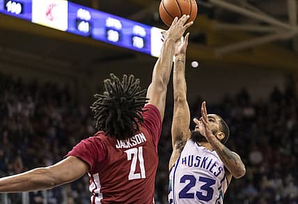 Feb 26, 2022; Seattle, Washington, USA; Washington guard Terrell Brown Jr. (23) shoots the balll over Washington State center Dishon Jackson (21) during the first half at Alaska Airlines Arena at Hec Edmundson Pavilion. Mandatory Credit: Stephen Brashear-USA TODAY Sports