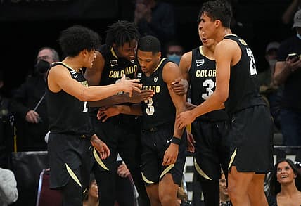 Feb 26, 2022; Boulder, Colorado, USA; Colorado Buffaloes guard Keeshawn Barthelemy (3) is congratulated for a score by guard KJ Simpson (2) and forward Jabari Walker (12) and guard Nique Clifford (32) and forward Tristan da Silva (23) during the second half against the Arizona Wildcats at the CU Events Center. Mandatory Credit: Ron Chenoy-USA TODAY Sports
