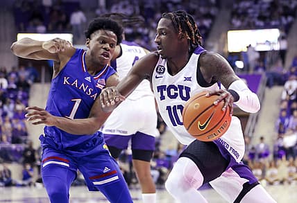Mar 1, 2022; Fort Worth, Texas, USA;  TCU Horned Frogs guard Damion Baugh (10) drives to the basket as Kansas Jayhawks guard Joseph Yesufu (1) defends during the first half at Ed and Rae Schollmaier Arena. Mandatory Credit: Kevin Jairaj-USA TODAY Sports