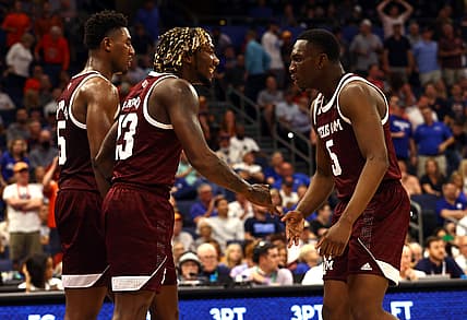 Mar 11, 2022; Tampa, FL, USA; Texas A&M Aggies guard Tyrece Radford (23) is congratulated by guard Hassan Diarra (5) and forward Henry Coleman III (15) during the first half at Amalie Arena. Mandatory Credit: Kim Klement-USA TODAY Sports