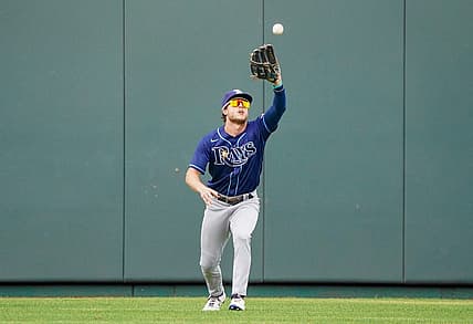 Jul 24, 2022; Kansas City, Missouri, USA; Tampa Bay Rays center fielder Roman Quinn (25) fields a long fly ball against the Kansas City Royals in the seventh inning at Kauffman Stadium. Mandatory Credit: Denny Medley-USA TODAY Sports