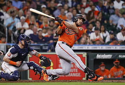 Aug 27, 2022; Houston, Texas, USA; Baltimore Orioles left fielder Anthony Santander (25) hits a home run during the third inning against the Houston Astros at Minute Maid Park. Mandatory Credit: Troy Taormina-USA TODAY Sports