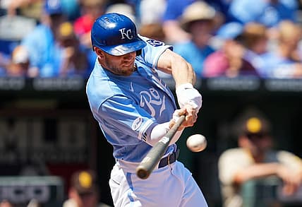 Aug 28, 2022; Kansas City, Missouri, USA; Kansas City Royals third baseman Hunter Dozier (17) hits a single against the San Diego Padres during the first inning at Kauffman Stadium. Mandatory Credit: Jay Biggerstaff-USA TODAY Sports