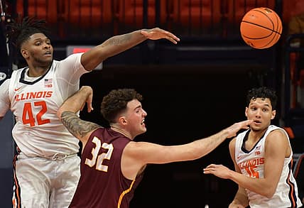 Dec 29, 2022; Champaign, Illinois, USA;  Illinois Fighting Illini forward Dain Dainja (42) blocks the shot of Bethune-Cookman Wildcats center Elijah Hulsewe (32) during the first half at State Farm Center. Mandatory Credit: Ron Johnson-USA TODAY Sports