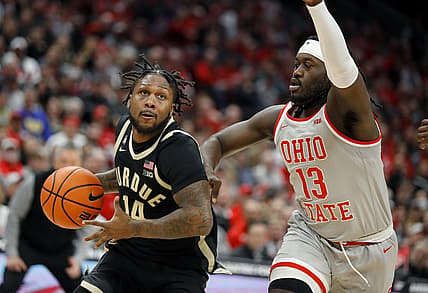 Jan 5, 2023; Columbus, Ohio, USA;  Purdue Boilermakers guard David Jenkins Jr. (14) drives past Ohio State Buckeyes guard Isaac Likekele (13) during the first half at Value City Arena. Mandatory Credit: Joseph Maiorana-USA TODAY Sports
