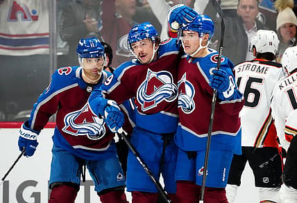 Nov 15, 2023; Denver, Colorado, USA; Colorado Avalanche defenseman Samuel Girard (49) celebrates his goal with center Ross Colton (20) and center Andrew Cogliano (11) in the first period at Ball Arena. Mandatory Credit: Ron Chenoy-USA TODAY Sports