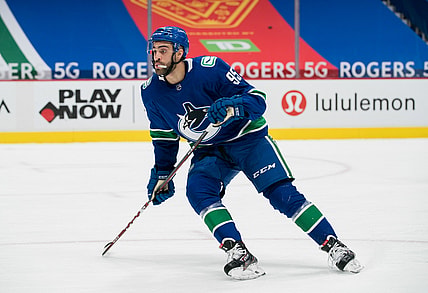 Feb 11, 2021; Vancouver, British Columbia, CAN; Vancouver Canucks forward Justin Bailey (95) skates against the Calgary Flames in the third period at Rogers Arena. Calgary won 3-1. Mandatory Credit: Bob Frid-USA TODAY Sports
