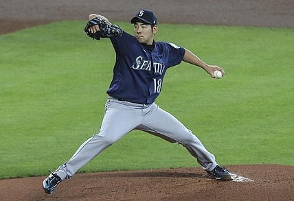 Apr 29, 2021; Houston, Texas, USA; Seattle Mariners starting pitcher Yusei Kikuchi (18) pitches against the Houston Astros in the first inning at Minute Maid Park. Mandatory Credit: Thomas Shea-USA TODAY Sports