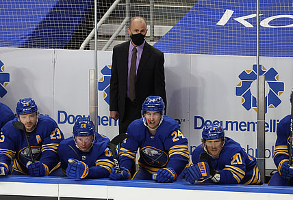 May 3, 2021; Buffalo, New York, USA;  Buffalo Sabres head coach Don Granato watches his team from the bench during the second period against the New York Islanders at KeyBank Center. Mandatory Credit: Timothy T. Ludwig-USA TODAY Sports