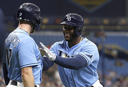 Jul 30, 2021; St. Petersburg, Florida, USA; Tampa Bay Rays first baseman Yandy Diaz (2) is congratulated by Tampa Bay Rays left fielder Austin Meadows (17) after he hit a two run home run during the first inning against the Boston Red Sox at Tropicana Field. Mandatory Credit: Kim Klement-USA TODAY Sports