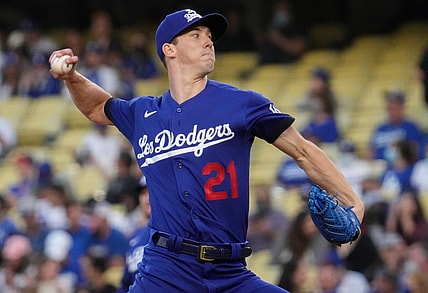 Aug 20, 2021; Los Angeles, California, USA; Los Angeles Dodgers starting pitcher Walker Buehler (21) throws a pitch during the first inning against the New York Mets at Dodger Stadium. Mandatory Credit: Robert Hanashiro-USA TODAY Sports
