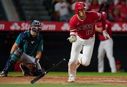 Sep 25, 2021; Anaheim, California, USA; Los Angeles Angels designated hitter Shohei Ohtani (17) triples against the Seattle Mariners in the third inning at Angel Stadium. Mandatory Credit: Robert Hanashiro-USA TODAY Sports