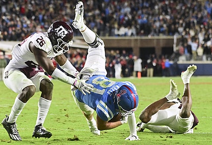 Nov 13, 2021; Oxford, Mississippi, USA; Mississippi Rebels tight end Casey Kelly (81) is stopped short of the endzone by Texas A&M Aggies defensive back Demani Richardson (26) and defensive back Tyreek Chappell (7) during the second quarter at Vaught-Hemingway Stadium. Mandatory Credit: Matt Bush-USA TODAY Sports