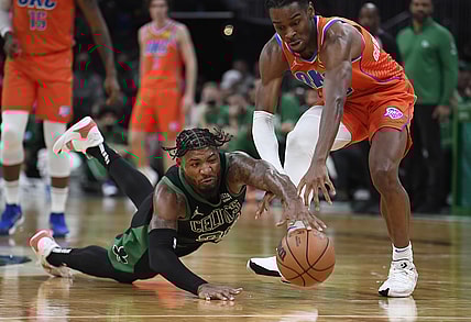 Nov 20, 2021; Boston, Massachusetts, USA;  Boston Celtics guard Marcus Smart (36) dives for a loose ball in front of Oklahoma City Thunder guard Shai Gilgeous-Alexander (2) during the second half at TD Garden. Mandatory Credit: Bob DeChiara-USA TODAY Sports