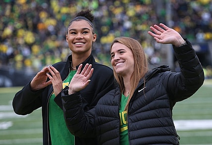 Former Oregon women basketball players Satou Sabally, left, and Sabrina Ionescu are introduced during the Oregon Colorado Saturday Oct. 30, 2021.

Eug 103021 Uo Cofb10