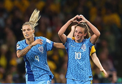 England's Ella Toone celebrates scoring their first goal with Rachel Daly.