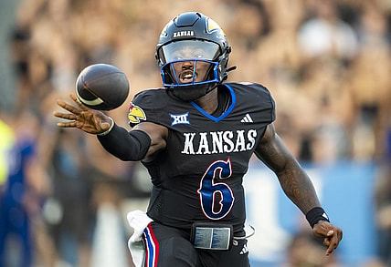Sep 8, 2023; Lawrence, Kansas, USA; Kansas Jayhawks quarterback Jalon Daniels (6) pitches the ball during the first half against the Illinois Fighting Illini at David Booth Kansas Memorial Stadium. Mandatory Credit: Jay Biggerstaff-USA TODAY Sports
