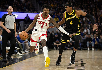 Nov 20, 2023; San Francisco, California, USA; Houston Rockets guard Jalen Green (4) dribbles against Golden State Warriors guard Moses Moody (4) during the third quarter at Chase Center. Mandatory Credit: D. Ross Cameron-USA TODAY Sports