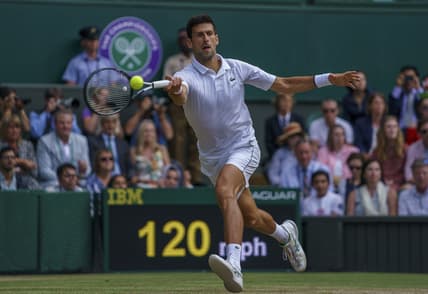 Jul 14, 2019; London, United Kingdom; Novak Djokovic (SRB) in action during the mens final match against Roger Federer (SUI) on day 13 at the All England Lawn and Croquet Club. Mandatory Credit: Susan Mullane-USA TODAY Sports