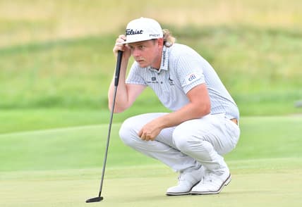 Aug 21, 2021; Jersey City, New Jersey, USA; Cameron Smith  lines up his putt on the 2nd hole during the third round of The Northern Trust golf tournament at the Liberty National Golf Club. Mandatory Credit: Mark Konezny-USA TODAY Sports