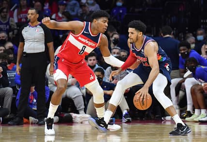 Feb 2, 2022; Philadelphia, Pennsylvania, USA; Philadelphia 76ers forward Tobias Harris (12) is defended by Washington Wizards forward Rui Hachimura (8) during the second quarter at Wells Fargo Center. Mandatory Credit: Eric Hartline-USA TODAY Sports