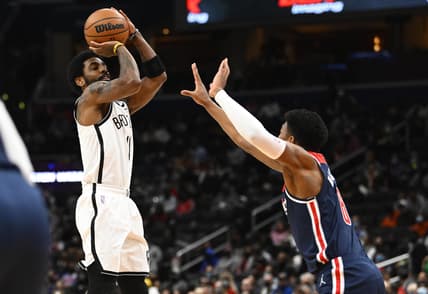 Feb 10, 2022; Washington, District of Columbia, USA; Brooklyn Nets guard Kyrie Irving (11) shoots over Washington Wizards forward Rui Hachimura (8) during the first half at Capital One Arena. Mandatory Credit: Brad Mills-USA TODAY Sports
