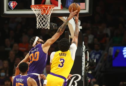 Apr 5, 2022; Phoenix, Arizona, USA; Los Angeles Lakers forward Anthony Davis (3) has his shot blocked by Phoenix Suns center JaVale McGee (00) in the first half at Footprint Center. Mandatory Credit: Mark J. Rebilas-USA TODAY Sports