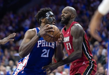 May 6, 2022; Philadelphia, Pennsylvania, USA; Philadelphia 76ers center Joel Embiid (21) drives against Miami Heat center Dewayne Dedmon (21) during the third quarter in game three of the second round for the 2022 NBA playoffs at Wells Fargo Center. Mandatory Credit: Bill Streicher-USA TODAY Sports