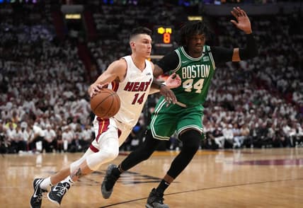 May 17, 2022; Miami, Florida, USA; Miami Heat guard Tyler Herro (14) dribbles up the court against Boston Celtics center Robert Williams III (44) during the second half of game one of the 2022 eastern conference finals at FTX Arena. Mandatory Credit: Jasen Vinlove-USA TODAY Sports