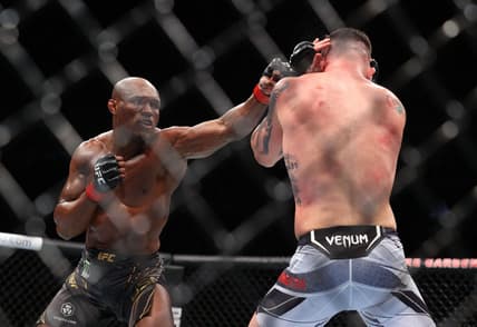 Nov 6, 2021; New York, NY, USA; Kamaru Usman (red gloves) competes against Colby Covington (blue gloves) during UFC 268 at Madison Square Garden. Mandatory Credit: Ed Mulholland-USA TODAY Sports