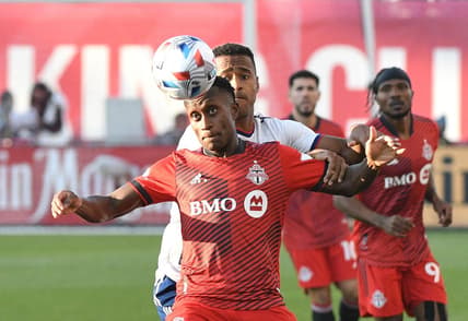 Nov 7, 2021; Toronto, Ontario, CAN;  Toronto FC defender Richie Laryea (22) watches the ball ahead of DC United forward Ola Kamara (9) in the first half at BMO Field. Mandatory Credit: Dan Hamilton-USA TODAY Sports
