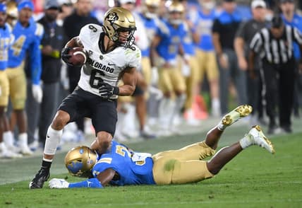 Nov 13, 2021; Pasadena, California, USA; Colorado Buffaloes wide receiver Daniel Arias (6) is tackled by UCLA Bruins defensive back Cameron Johnson (3) in the second half at Rose Bowl. Mandatory Credit: Jayne Kamin-Oncea-USA TODAY Sports