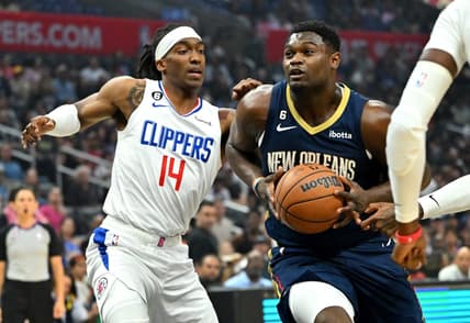 Oct 30, 2022; Los Angeles, California, USA;  Los Angeles Clippers guard Terance Mann (14) defends New Orleans Pelicans forward Zion Williamson (1) as he drive to the basket in the first half at Crypto.com Arena. Mandatory Credit: Jayne Kamin-Oncea-USA TODAY Sports