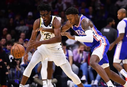 Oct 24, 2022; Philadelphia, Pennsylvania, USA; Indiana Pacers forward Jalen Smith (25) and Philadelphia 76ers forward Paul Reed (44) dive for a loose ball in the second quarter at Wells Fargo Center. Mandatory Credit: Kyle Ross-USA TODAY Sports