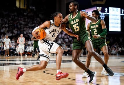 Vanderbilt guard Tyrin Lawrence (0) works the ball past UAB forward Ty Brewer (15) during the first half of an NIT quarterfinal game at Memorial Gym in Nashville, Tenn., Wednesday, March 22, 2023.

Vandynit 032223 An 005