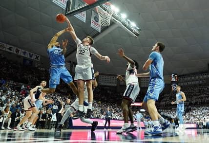 Jan 17, 2024; Storrs, Connecticut, USA; Connecticut Huskies center Donovan Clingan (32) blocks the shot of Creighton Bluejays guard Trey Alexander (23) in the first half at Harry A. Gampel Pavilion. Mandatory Credit: David Butler II-USA TODAY Sports